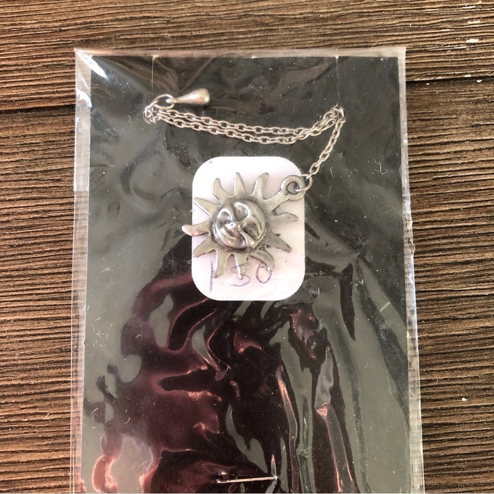 Sliver metal sun bookmark
